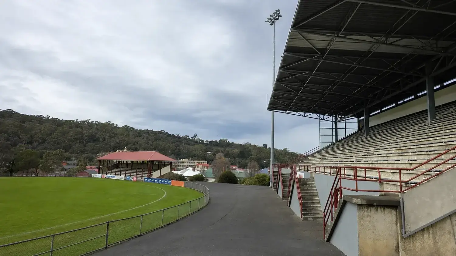 Grandstand, sports lighting and public infrastructure at a Hobart sporting facility.